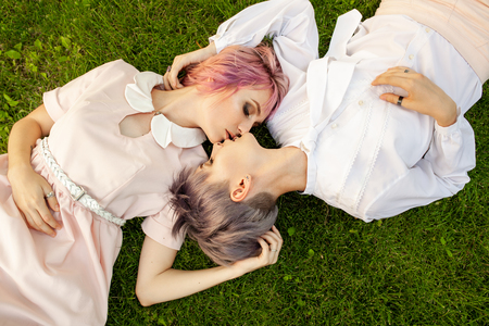 Happy playful lesbian couple in love sharing time together Women friendship concept with girls couple having fun on fashion clothes outdoors Summertime leisure. Friendship conceptの写真素材