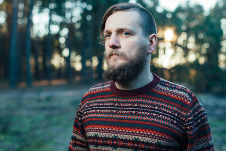 Handsome man or lumberjack, bearded hipster, with beard and moustache outdoors on natural backgroundの写真素材