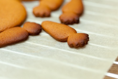 cooking and home concept - close up of female hands making cookies from fresh dough at homeの写真素材
