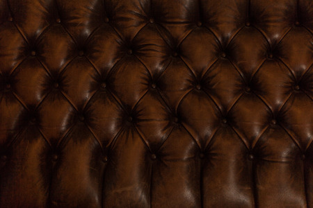 Luxury brown leather sofa background texture close upの写真素材