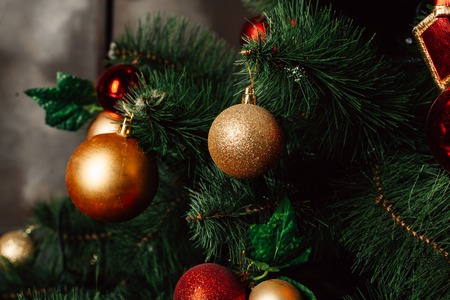 Christmas toy on the Christmas tree. Decorated Christmas tree ball. Christmas ball close up. Selective focus. Horizontal photoの写真素材