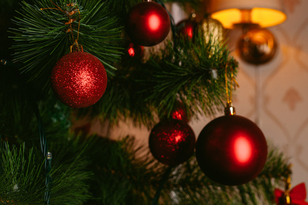 Christmas toy on the Christmas tree. Decorated Christmas tree ball. Christmas ball close up. Selective focus. Horizontal photoの写真素材