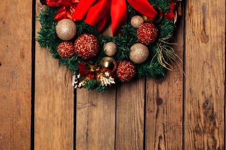 Christmas wreath. Winter holidays tradition, Jingle bells,Light garland , Holly berry, Candy cane ,top viewの写真素材