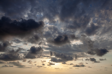 Fantastic sky, dramatic sunset, beautiful natural background. Setting sun illuminates the cloudsの写真素材