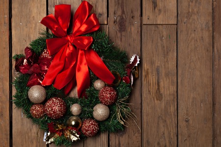 Christmas wreath. Winter holidays tradition, Jingle bells,Light garland , Holly berry, Candy cane ,top viewの写真素材
