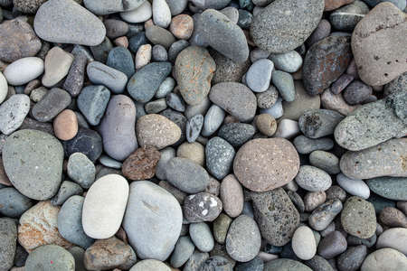 abstract background with dry round peeble stones. Sea stone close up.の写真素材