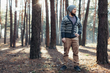 Outdoor portrait of handsome bearded man . Casual autumn fashion portrait Hipster in the forestの写真素材