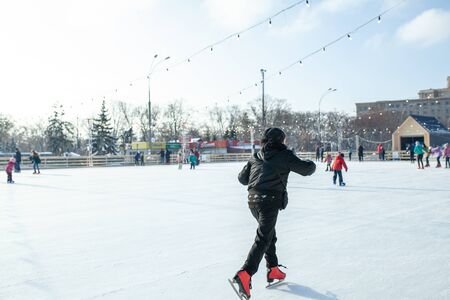 Ukraine, Kharkov 30 December 2018 People skate in the city park on Freedom Square. Excellent family leisure on weekends and holidaysのeditorial素材