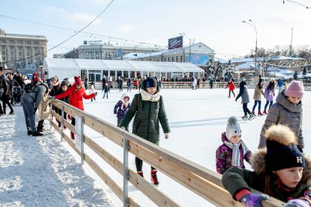 Ukraine, Kharkov 30 December 2018 People skate in the city park on Freedom Square. Excellent family leisure on weekends and holidaysのeditorial素材