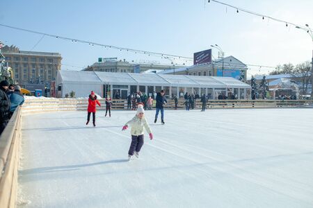 Ukraine, Kharkov 30 December 2018 People skate in the city park on Freedom Square. Excellent family leisure on weekends and holidaysのeditorial素材