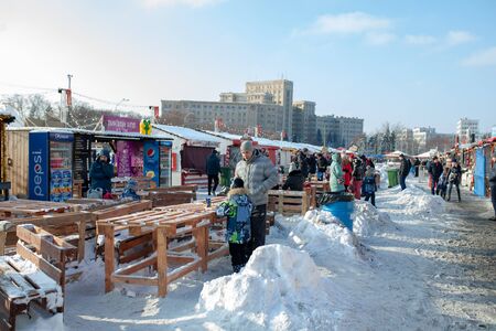 Ukraine, Kharkov 30 December 2018 Christmas market. New Year's Fair. Winter street food. Holidays and weekends in the city. Family Leisure.のeditorial素材