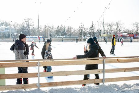 Ukraine, Kharkov 30 December 2018 People skate in the city park on Freedom Square. Excellent family leisure on weekends and holidaysのeditorial素材
