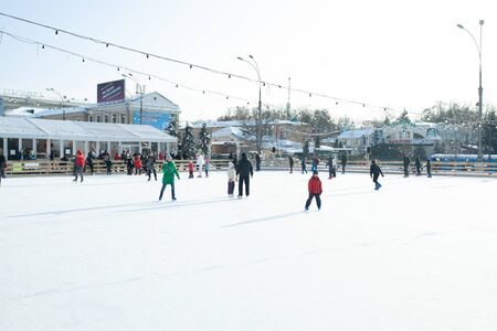 Ukraine, Kharkov 30 December 2018 People skate in the city park on Freedom Square. Excellent family leisure on weekends and holidaysのeditorial素材