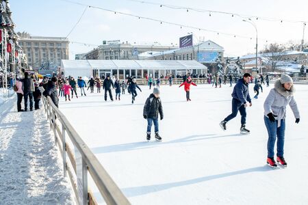 Ukraine, Kharkov 30 December 2018 People skate in the city park on Freedom Square. Excellent family leisure on weekends and holidaysのeditorial素材