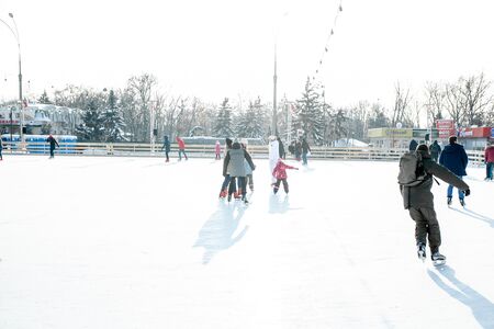 Ukraine, Kharkov 30 December 2018 People skate in the city park on Freedom Square. Excellent family leisure on weekends and holidaysのeditorial素材