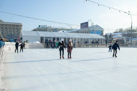 Ukraine, Kharkov 30 December 2018 People skate in the city park on Freedom Square. Excellent family leisure on weekends and holidaysのeditorial素材