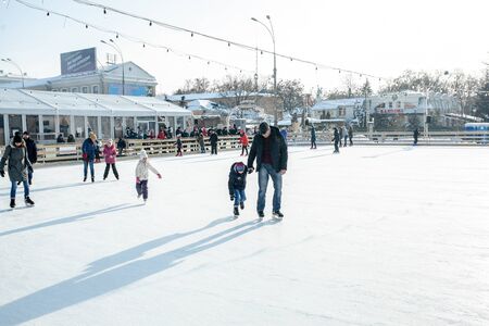 Ukraine, Kharkov 30 December 2018 People skate in the city park on Freedom Square. Excellent family leisure on weekends and holidaysのeditorial素材
