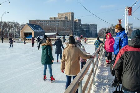 Ukraine, Kharkov 30 December 2018 People skate in the city park on Freedom Square. Excellent family leisure on weekends and holidaysのeditorial素材