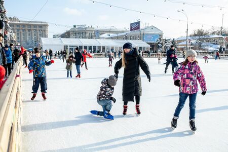 Ukraine, Kharkov 30 December 2018 People skate in the city park on Freedom Square. Excellent family leisure on weekends and holidaysのeditorial素材