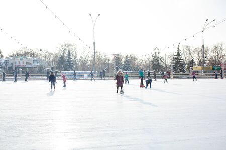 Ukraine, Kharkov 30 December 2018 People skate in the city park on Freedom Square. Excellent family leisure on weekends and holidaysのeditorial素材