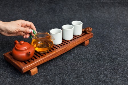 Chinese tea ceremony Asian wooden table board chaban top view copy space morning energy. Breakfast green hot drink with caffeine traditional classic crockery tea set clay ceramic pot cups nature woodsの写真素材