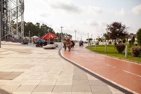 batumi, Georgia August 2018 Electric tricycle scooters for rent on Batumi New Boulevard. View of Batumi Boulevard Summerのeditorial素材