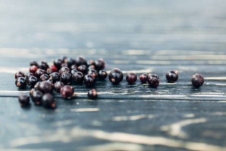 Black currant Closeup on black wooden background. Summer berry. Sweet, dessert, diet concept. Vegetarian, healthy, organic. Rusticの写真素材