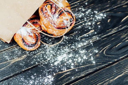 Mock up. Healthy tasty breakfast. Top view, copy space. Bakery on the white Wooden background. French breakfast. Paper package. Breakfast food table.の写真素材