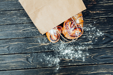 Mock up. Healthy tasty breakfast. Top view, copy space. Bakery on the white Wooden background. French breakfast. Paper package. Breakfast food table.の写真素材