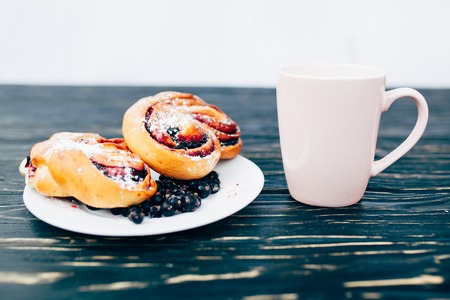 Rustic with black current berry filling pie on black wooden table background. Tasty breakfast. Bakery Fresh Healthy breakfast. Unhealthy food with glutenの写真素材