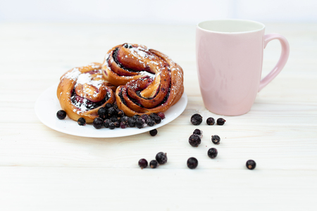 Rustic with black current berry filling pie on white wooden table background. Tasty breakfast. Bakery Fresh Healthy breakfast. Unhealthy food with glutenの写真素材