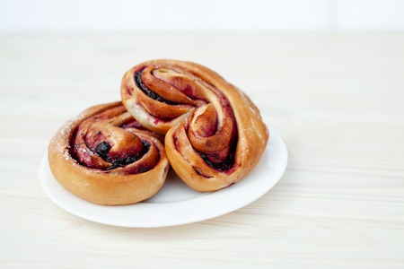 Rustic with black current berry filling pie on white wooden table background. Tasty breakfast. Bakery Fresh Healthy breakfast. Unhealthy food with glutenの写真素材