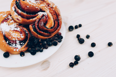Rustic with black current berry filling pie on white wooden table background. Tasty breakfast. Bakery Fresh Healthy breakfast. Unhealthy food with glutenの写真素材