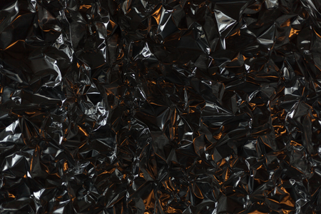 Full frame take of a sheeT of crumpled silver aluminum foil backgroundの写真素材