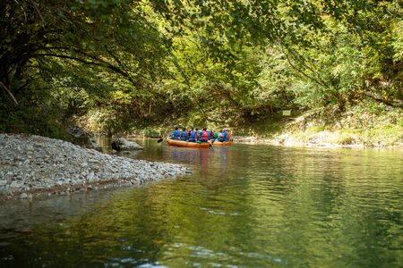 Martvili, Georgia September 2018 People on an excursion between rocks in inflatable boats along the canyon.のeditorial素材