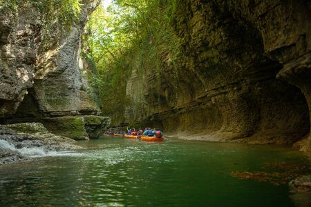Martvili, Georgia September 2018 People on an excursion between rocks in inflatable boats along the canyon.のeditorial素材