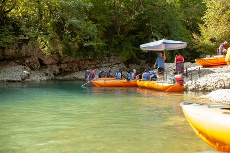 Martvili, Georgia September 2018 People on an excursion between rocks in inflatable boats along the canyon.のeditorial素材