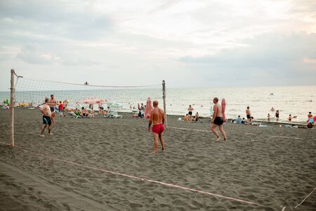 Georgia, Ureki August 2018 Black Sand Black camping. Beach volleyball at the summer.のeditorial素材