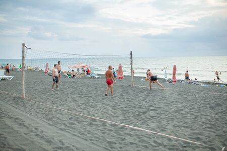 Georgia, Ureki August 2018 Black Sand Black camping. Beach volleyball at the summer.のeditorial素材