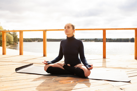 Nature meditation concept. Wellness and Health care, Woman meditating. Healthy lifestyle Yoga practice. Relaxationの写真素材