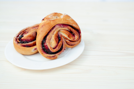 Rustic with black current berry filling pie on white wooden table background. Tasty breakfast. Bakery Fresh Healthy breakfast. Unhealthy food with glutenの写真素材