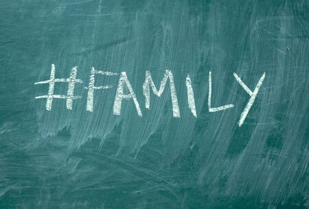Summer hashtag it handwritten with white chalk on a green blackboard.の写真素材