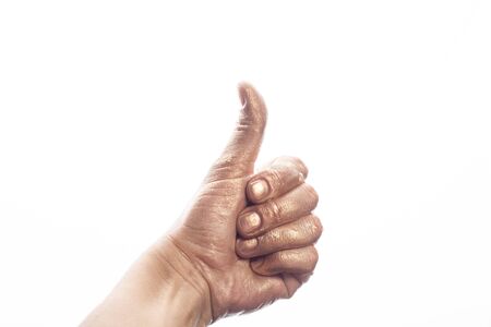 Human hand painted gold paint isolated on white background.の写真素材