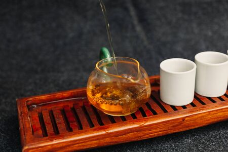 Chinese tea ceremony Asian wooden table board chaban top view copy space morning energy. Breakfast green hot drink with caffeine traditional classic crockery tea set clay ceramic pot cups nature woodsの写真素材