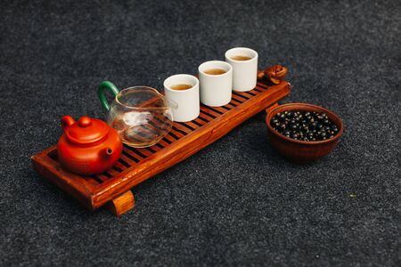 Chinese tea ceremony Asian wooden table board chaban top view copy space morning energy. Breakfast green hot drink with caffeine traditional classic crockery tea set clay ceramic pot cups nature woodsの写真素材