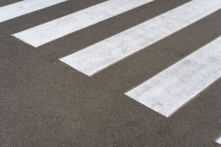 Pedestrian crossing, asphalt road top angle view. Background with free space for textの写真素材