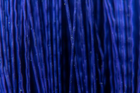 A texture consisting of dark blue in plastic twigs real close to each other.の写真素材
