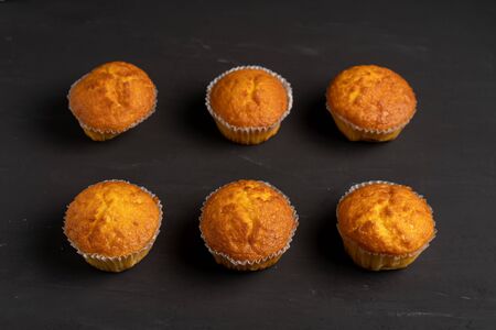 Appetizing muffins stand on a table top view. の写真素材