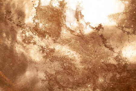Gold chemical dirty colored water background close up.の写真素材