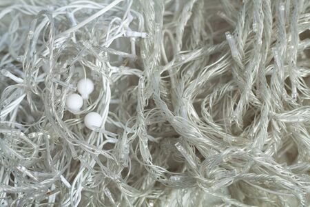 wires lead to lights on a strand of christmas bulbs.の写真素材